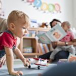 Little Boy Playing In A Classroom