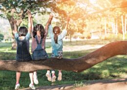 Children Friendship Concept With Happy Girl Kids In The Park Having Fun Sitting Under Tree Playing Together Enjoying Good Memory And Moment Of Student Friend Lifestyle In School Summer Time Day