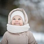 Pretty Toddler Girl Smiling In Winter Outdoors
