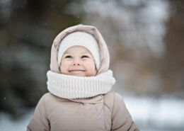 Pretty Toddler Girl Smiling In Winter Outdoors