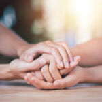 Husband and wife join hands to cheer ,Relationship care concept ,comforting family members ,mutual encouragement ,tenderness ,comfort and sympathy ,helping ,giving hope and believing