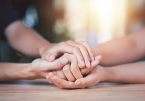 Husband and wife join hands to cheer ,Relationship care concept ,comforting family members ,mutual encouragement ,tenderness ,comfort and sympathy ,helping ,giving hope and believing