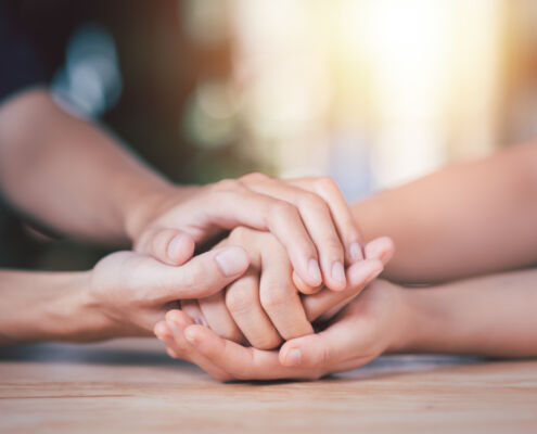 Husband and wife join hands to cheer ,Relationship care concept ,comforting family members ,mutual encouragement ,tenderness ,comfort and sympathy ,helping ,giving hope and believing