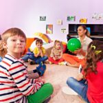 Kids And Teacher Sit In Circle