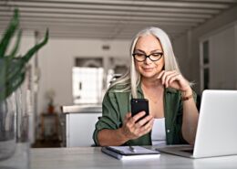 Stylish Senior Woman Messaging With Phone