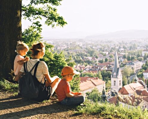 Family On Background Of Ljubljana, Slovenia, Europe.